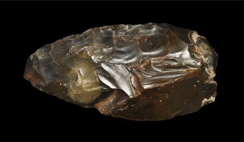 Stone Age Palaeolithic Flint Handaxe: Circa 350,000-250,000 BC A substantial flint handaxe of the classic English profile; some cortex remaining on the butt; small ancient loss to the tip. See Evans, J. Ancient Stone Implements of Great B