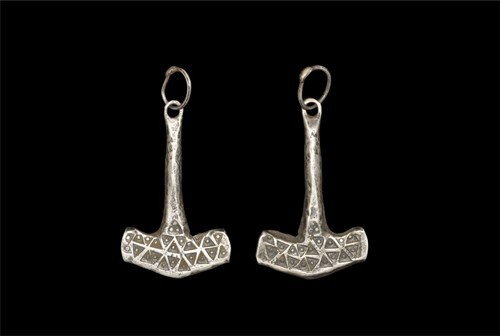 Viking Silver Thor's Hammer Pendant: Circa 9th-11th century AD A cast silver pendant in the form of a T-shaped hammer with tapering round-section shaft; the head decorated with a dense array of punched dot-in-triangle motifs extending to