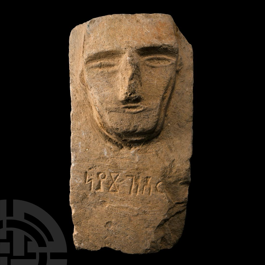 South Arabian Stone Stele with Personal Name: 3rd-1st century B.C. Bearing a stylised male face carved in relief above a Himyarite inscription. Cf. The British Museum, museum numbers 125108; 122010 and 104482, for similar.13.9 kg, 39 cm high (15 