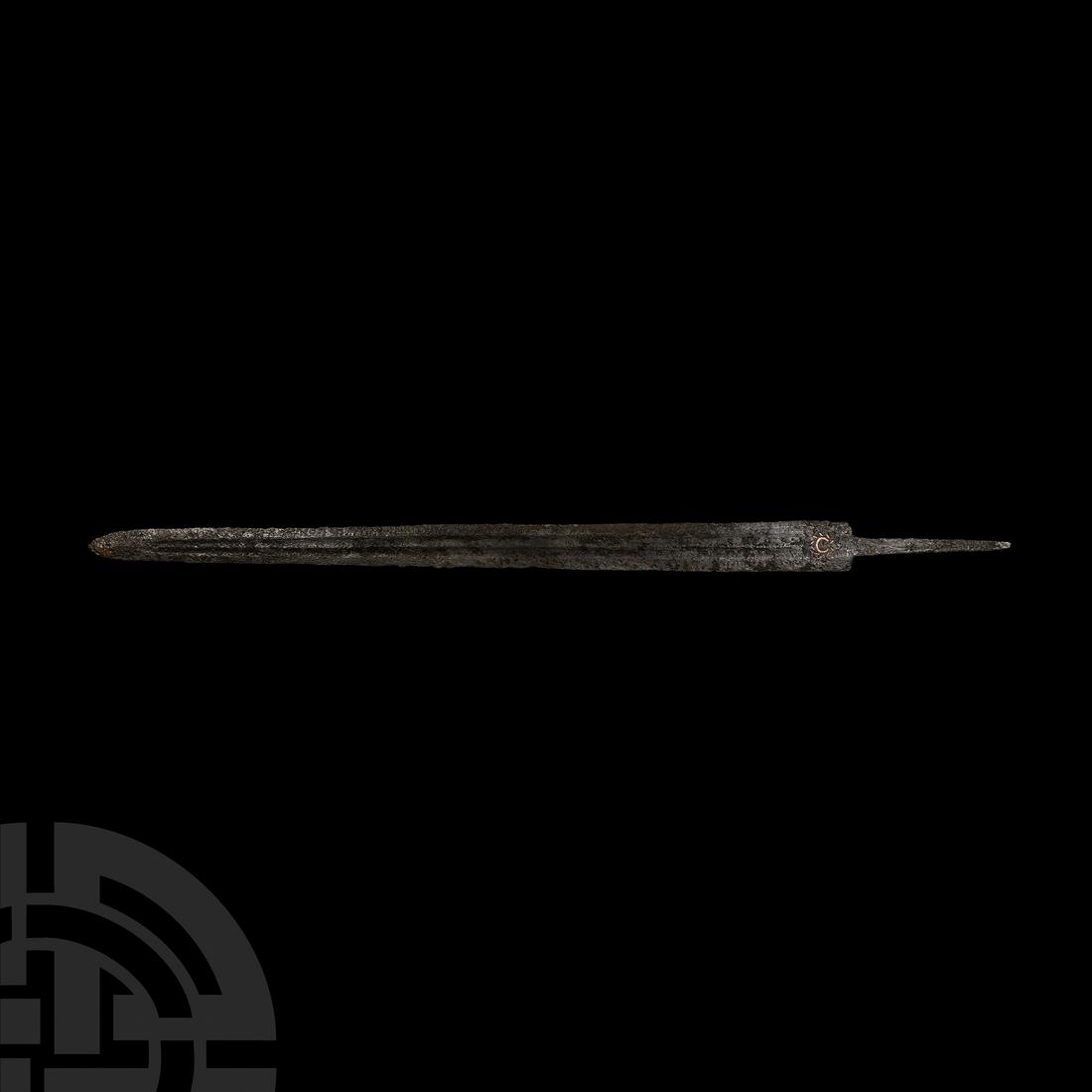 Roman Iron Spatha Sword: 3rd-4th century A.D. Comprising a wide double-edged blade of Illerup-Wyhl typology; blood channels and later inlays to both sides. Cf. Miks, C., Studien zur Romischen Schwertbewaffnung in der Kaiserze