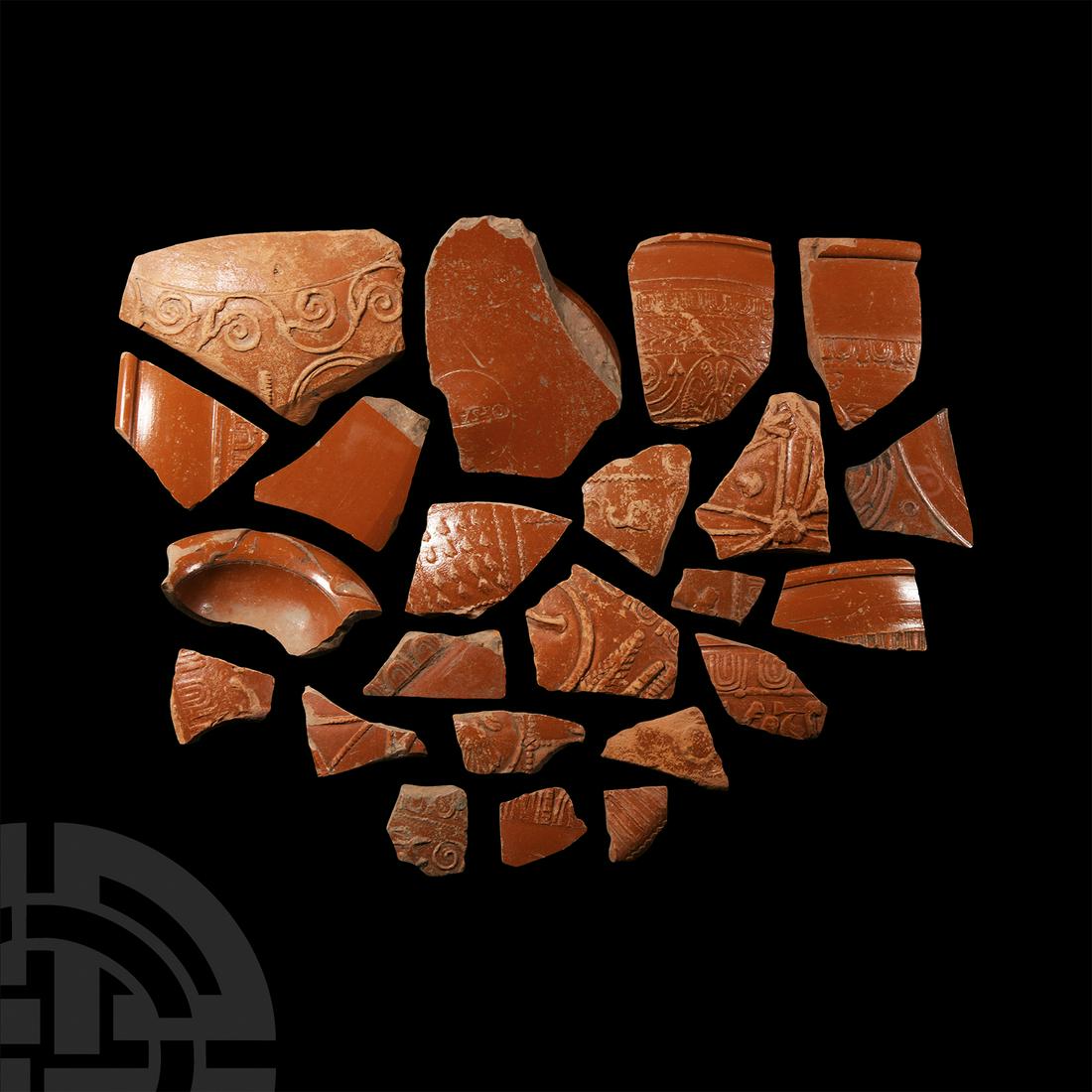 Roman 'Thames' Decorated Samian Ware Pottery Collection: Circa 2nd century A.D. Mainly from rims and bodies of vessels; most displaying a design in relief, including architectural elements, scrolling foliage and a maker's stamp. 440 grams total, 3-10.5 cm (