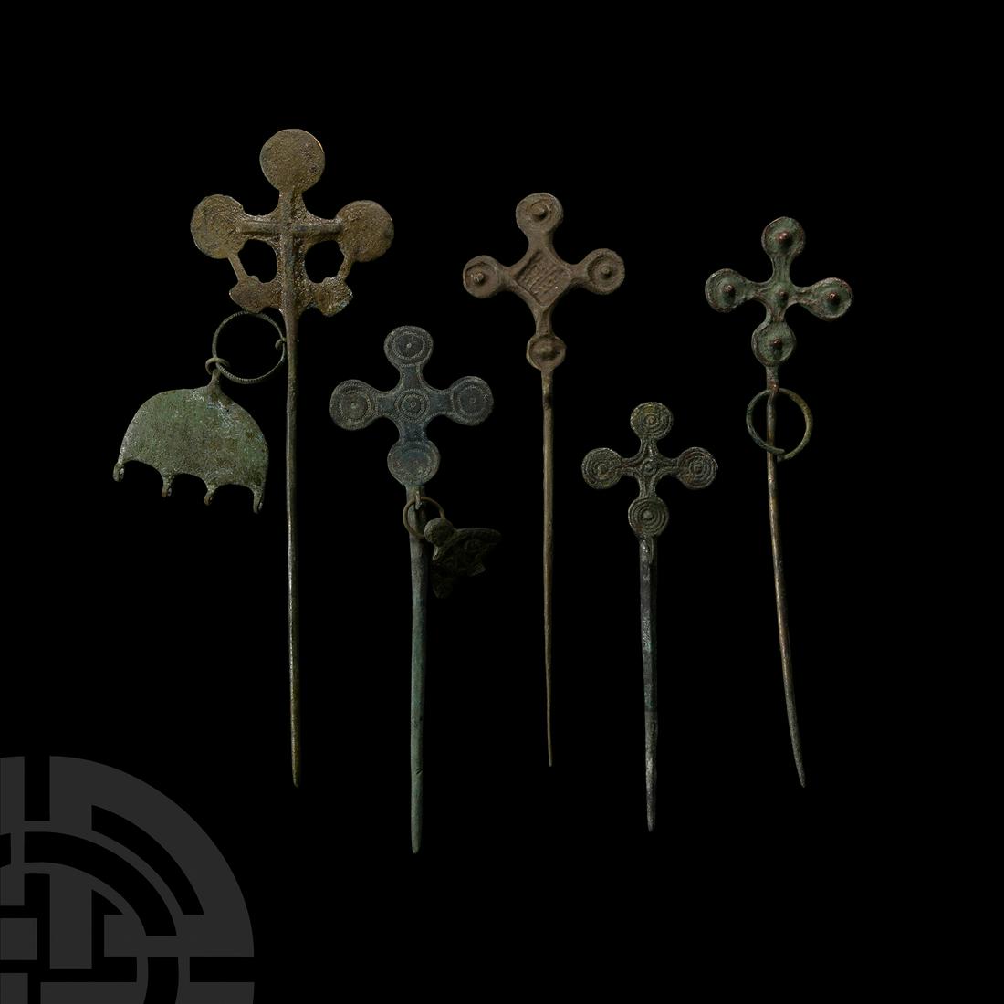 Viking Period Bronze Pin Collection with Lobed Cross Finials: 10th-11th century A.D. Together with suspension loops and including examples with pendants. 196 grams total, 14-22 cm (5 1/2 - 8 5/8 in.). From the collection of a North American gentleman, formed in 
