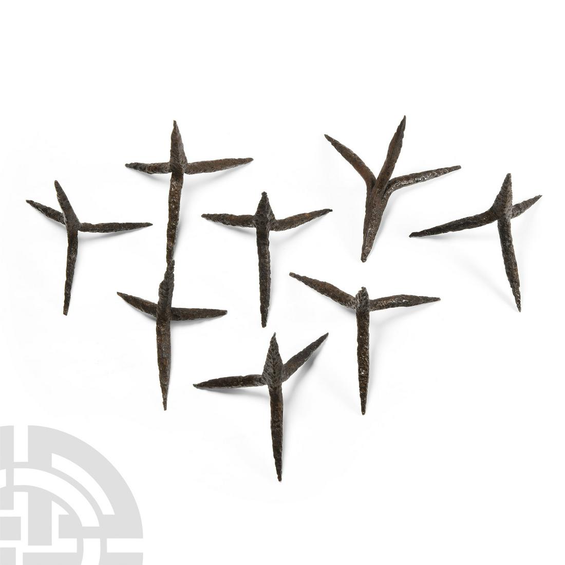 Medieval Iron Anti-Cavalry Caltrop Group: 13th-15th century A.D. A group of eight iron anti-cavalry caltrops, hand-forged with square-section spikes. Cf. Žákovský, P., ‘Caltrop. Contribution to the knowledge of one neglected weapon’ in