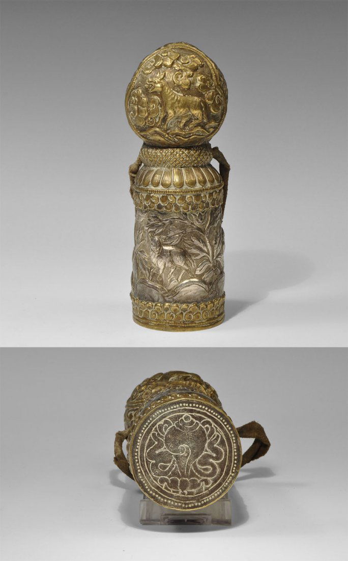 Tibetan Brass and White Metal Columnar Seal: Circa 19th century AD. A carved intaglio set in the base of a white metal column with spherical top; to the sides brass plates with animal and vegetation designs.