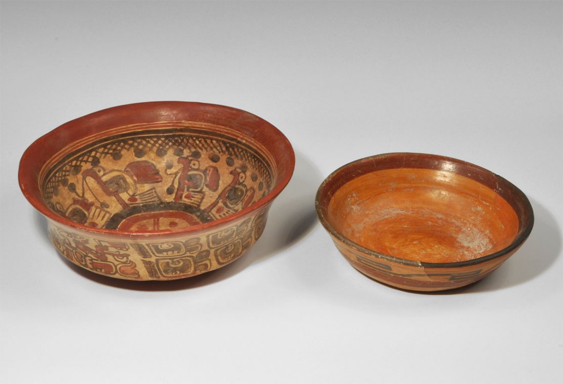 Central American Ceramic Painted Bowl Group: A mixed group of pre-Columbian ceramic bowls comprising:a shallow redware bowl with painted running key pattern in maroon, band to rim and outside, domed base; a large redware bowl with everted rim, r