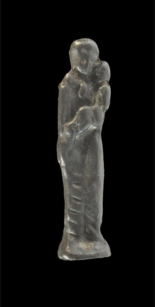 Post Medieval Bronze Madonna and Child Figurine: 18th century AD. A small cast bronze stylised figurine of the Madonna and Child, the Madonna wearing a long gown. Private collection, Nottinghamshire, UK; acquired late 1980's-early 1990's. Bronze, 21