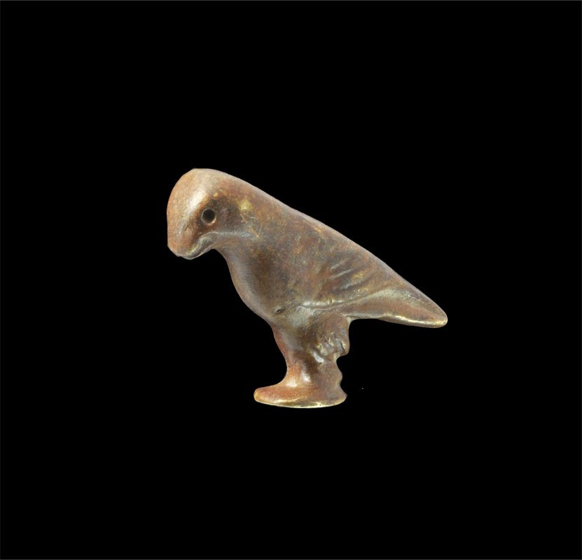 Islamic Seljuk Style Bronze Falcon Figurine: An undated cast bronze figurine of a standing falcon with feather detail to the wings and legs. Property of a London Gentleman; acquired before 1990. Bronze, 48 grams, 48 mm (1 3/4"). [No Reserve]