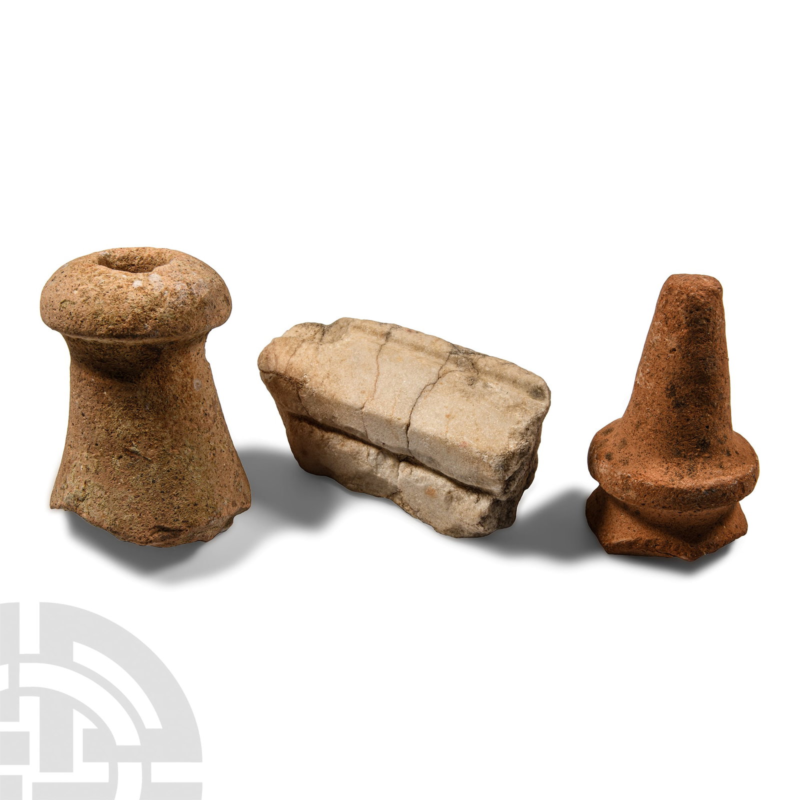 Roman Marble Fragment and Amphora Foot Group: 1st-4th century A.D. The marble architectural fragment with a carved groove to the sloped face; the terracotta feet from large wine amphoras, one with a decorative collar and the other with a void to 