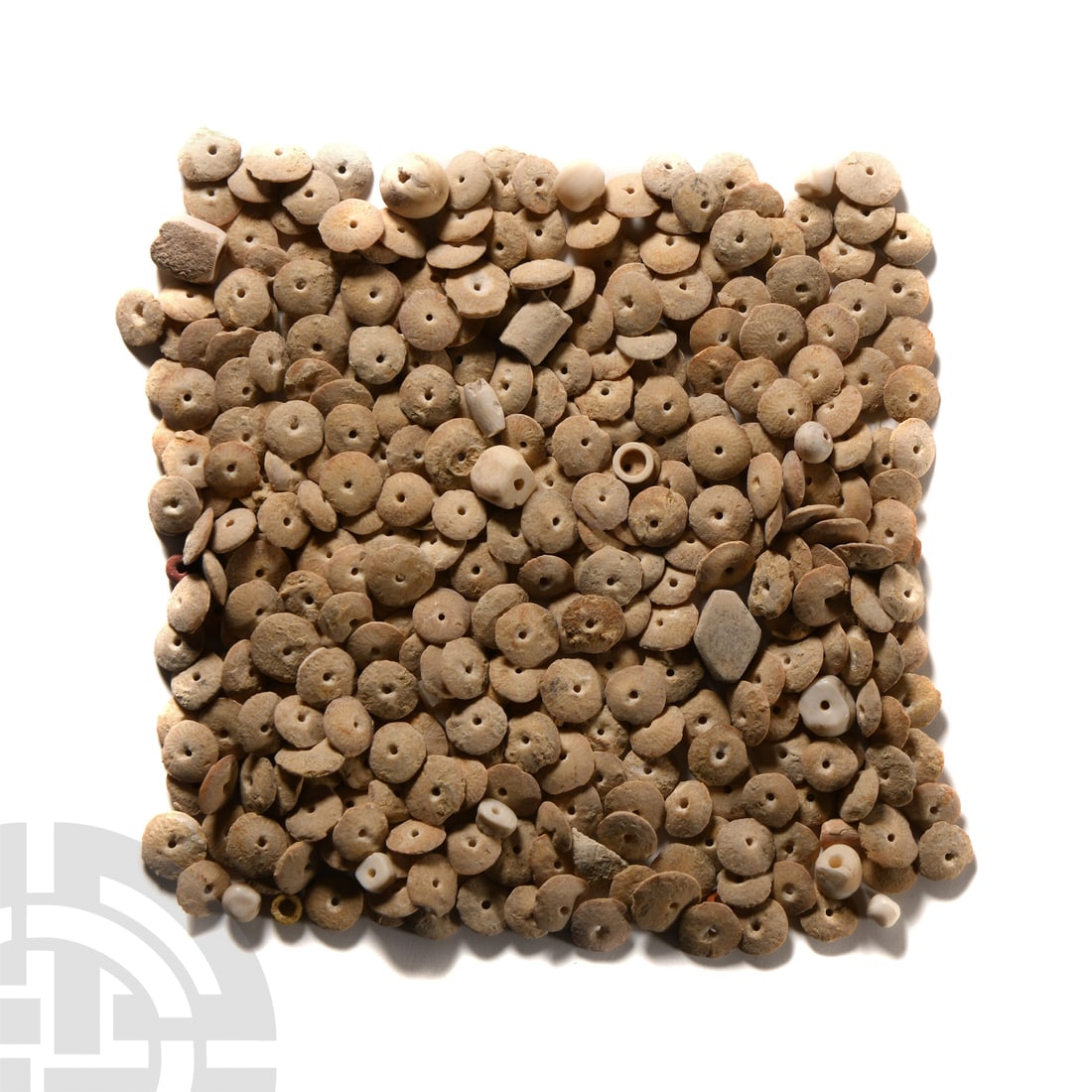 Mesopotamian Alabaster Disc Beads: Circa 4th millennium B.C. Comprising a quantity of small, mostly disc-shaped beads, in pale alabaster; each pierced for stringing. 63 grams total, 3-8 mm (1/8 - 1/4 in.). UK gallery, early 2000s. [No