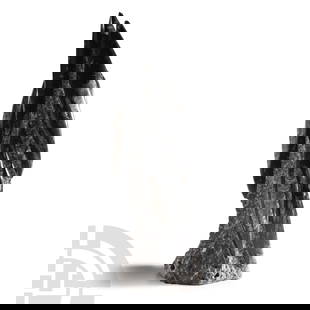 Natural History - Fossil Orthoceras Tower: Devonian Period, circa 385-359 million years B.P. Comprising seven Orthoceras fossils, polished to reveal their chambered structure. 4 kg, 36 cm high (14 1/8 in.). From Atlas Mountains, Morocco. From