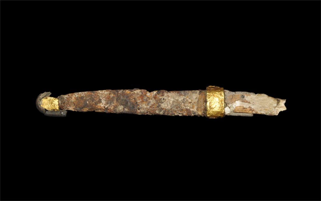 Merovingian Frankish Alemannic Knife with Gold Foil Col: Circa 6th-7th century AD. An iron knife with triangular-section blade, with remains of bone scales to the grip; below the grip, the collar with a gold foil sleeve with repousse borders; to the tip, a 