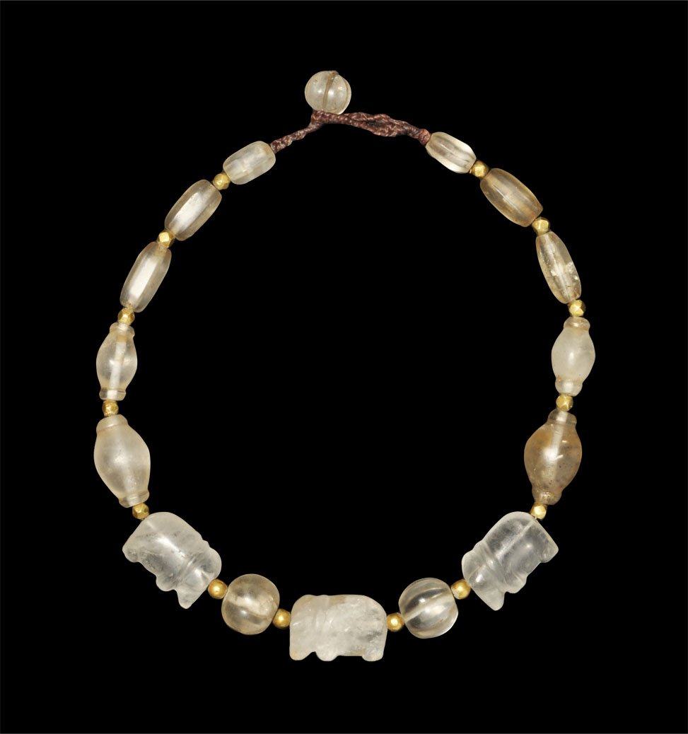 Burmese Crystal Elephant, Melon and Gold Spacer Bead Ne: An undated restrung necklace of crystal facetted tubular, melon, globular and elephant-shaped beads, with gold spherical and polyhedral spacers; modern clasp; London collection; acquired in the 1950's