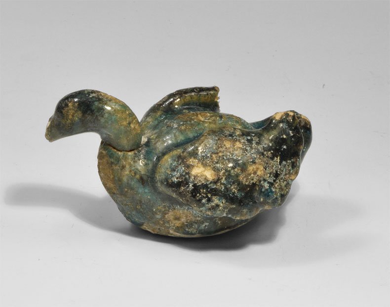 Islamic Ceramic Glazed Bird Figurine: An undated, possibly medieval, Syrian blue-glazed ceramic bird with lanceolate wings. London private collection, acquired 1950's-1970's. Ceramic, 138 grams, 99 mm (3 3/4").