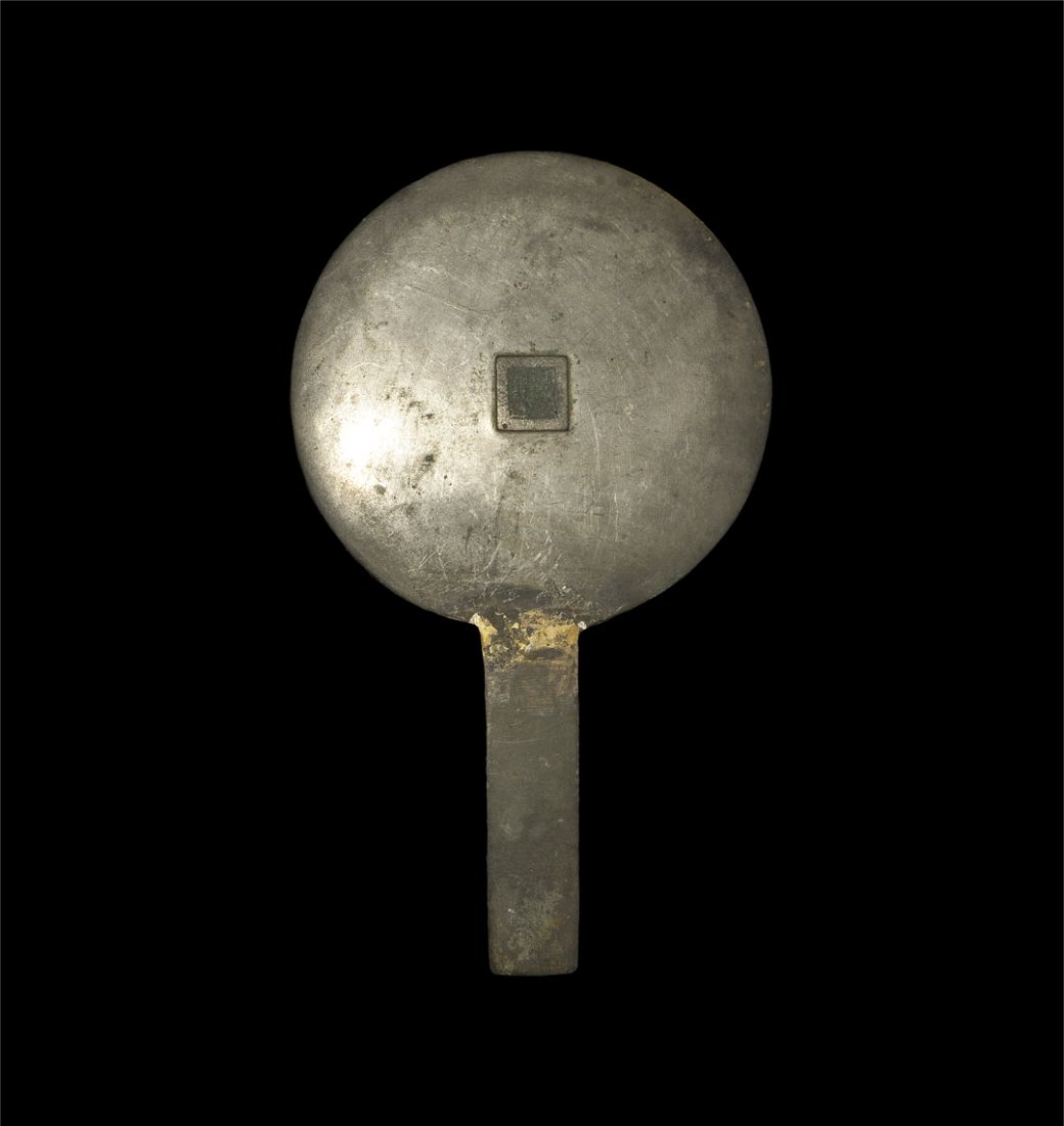 Chinese Bronze Han Dynasty Hand Mirror: Han Dynasty, 206 BC-220 AD. A tinned bronze mirror with discoid plate and flat-section rectangular handle; to the reverse a square panel with the owner's name reserved in the field. Property of a Lond