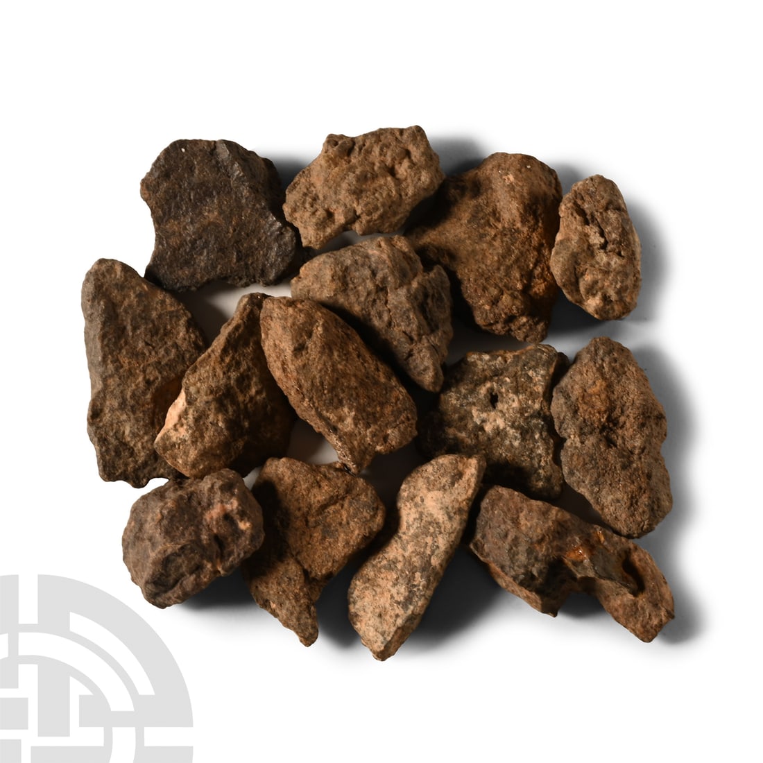 Natural History - Group of Al Haggounia 001 Meteorites: Found Sahara 2006 A.D.. Comprising fourteen variously sized samples. 22.3 grams total, 13.6-22.4 mm (1/2 - 7/8 in.). Ex Adrian Contreras, Crater Meteorites, Spain.Property of an East Sussex, UK, gentl
