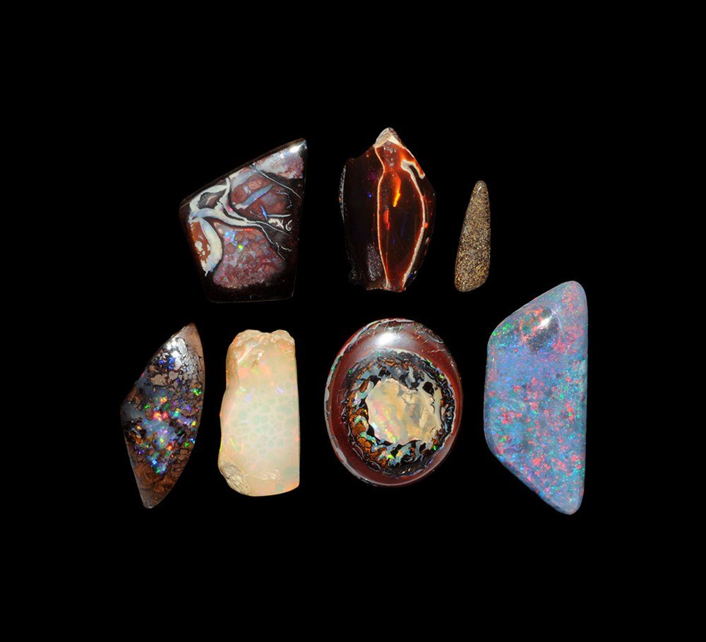 Collection of Polished Opals: A mixed croup of eight freeform polished Australian opals, including a triplet and pieces of boulder opal. 20 grams, 15-34 mm, 102.2 carats total. (1/2 - 1 1/4"). Ex Douglas Rose collection. [8, No Re