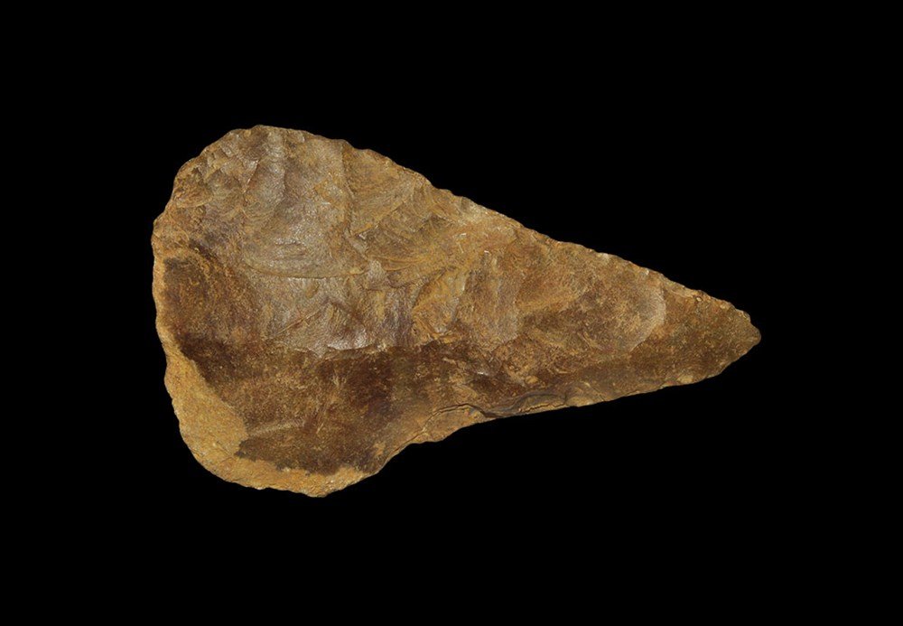 Stone Age English Coup-de-Poing Bifacial Flint Hand Axe: Palaeolithic, circa 600,000-400,000 BP A fully bifacial core hand axe, finely knapped with slightly concave sides tapering to a fine point in an orange-brown coarse flint with small area of original c