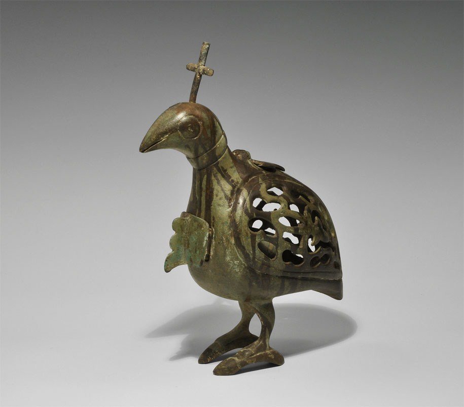 Islamic Persian Khorasan Bronze Dove Incense Burner: 17th century AD A fabricated incense burner in the form of a dove with openwork body, cruciform mount to the top of the head, incense tray to the chest, vent to shoulders with hinged fleur-de-lis lid.