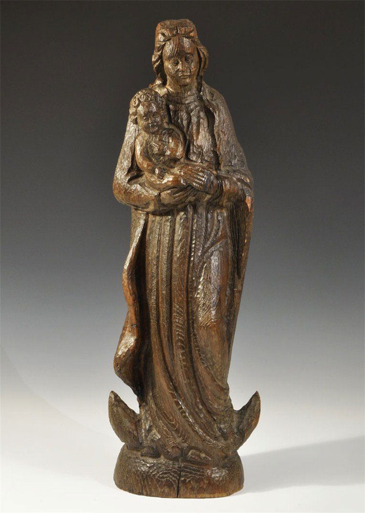 Post Medieval Wood Madonna and Child Figurine: 20th century AD. A large carved figurine depicting the Madonna and child on a domed base; the figure robed with a long mantle; the child held to the chest in both hands; flat to the reverse. Private c