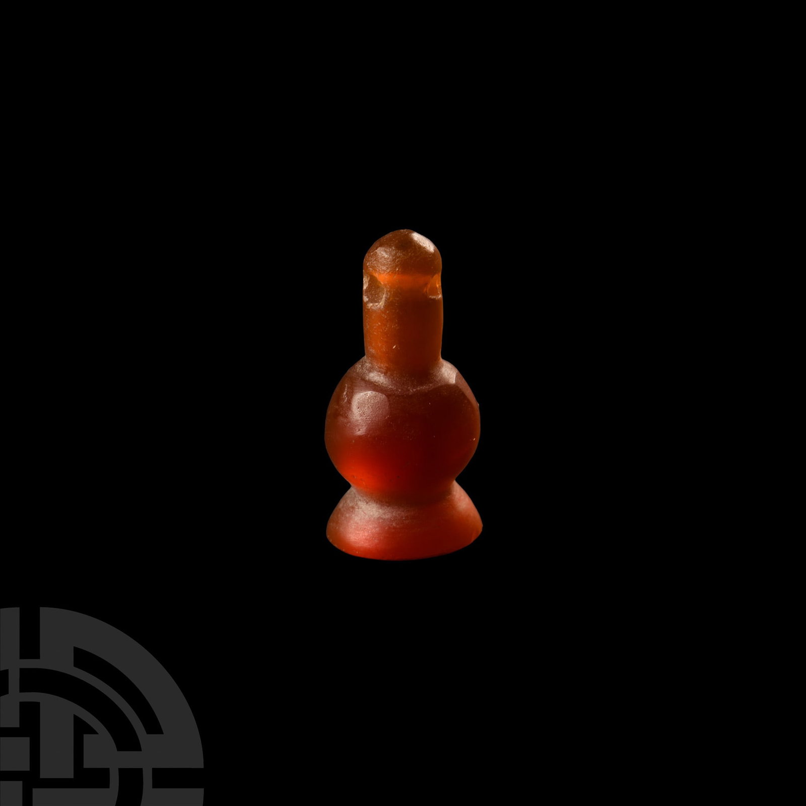 Egyptian Carnelian Poppy Head Amulet: New Kingdom, 18th Dynasty, 1550-1292 B.C. Polished and with integral pierced suspension loop. Cf. The Metropolitan Museum, New York, accession number 40.9.26, for similar; cf. Andrews, C., Amulets of 