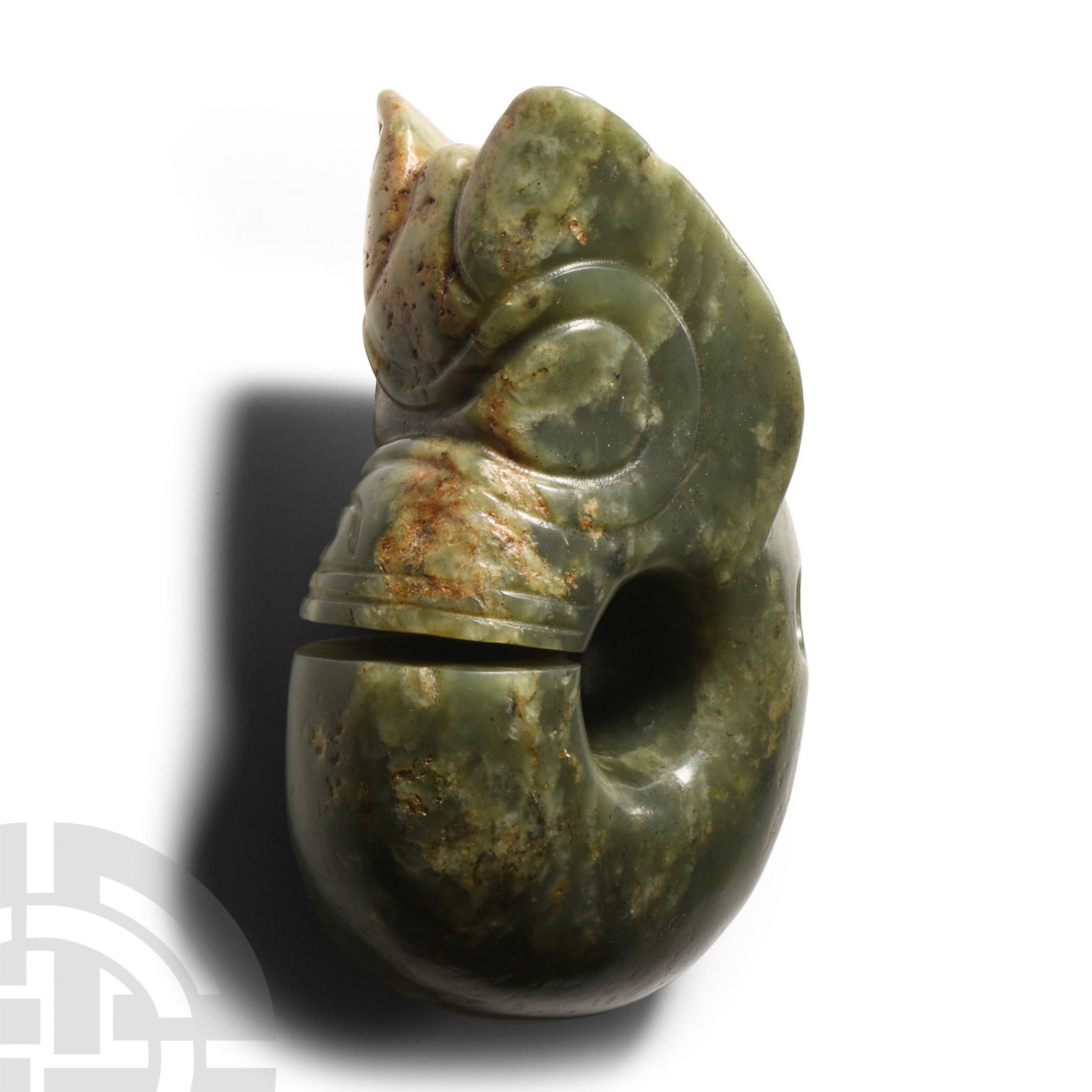 Chinese Hongshan Style Serpentine Dragon Pig: 20th century A.D. Carved jade weight with grotesque face and penannular D-section body, pierced at the neck. 644 grams, 12.2 cm (4 3/4 in.). Acquired UK, in the 1980s. Property of a retired South West