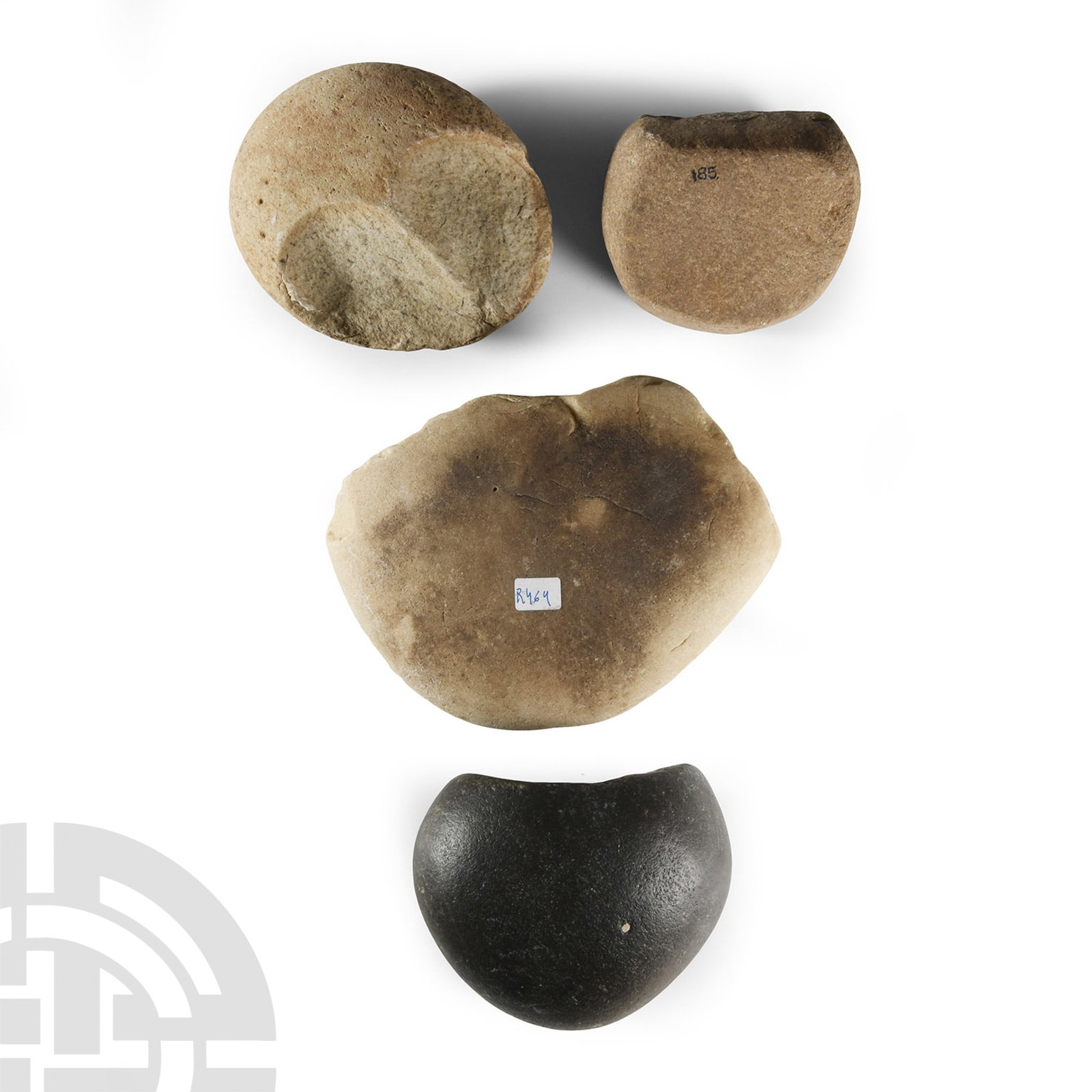 Native American Smoothing Stone Group: Late Woodland Period, 1st millennium A.D. Including a flat biconvex type with broken edge and old collector's label 'R464', cobble type with scooped depression, D-shaped type with two flat faces marke