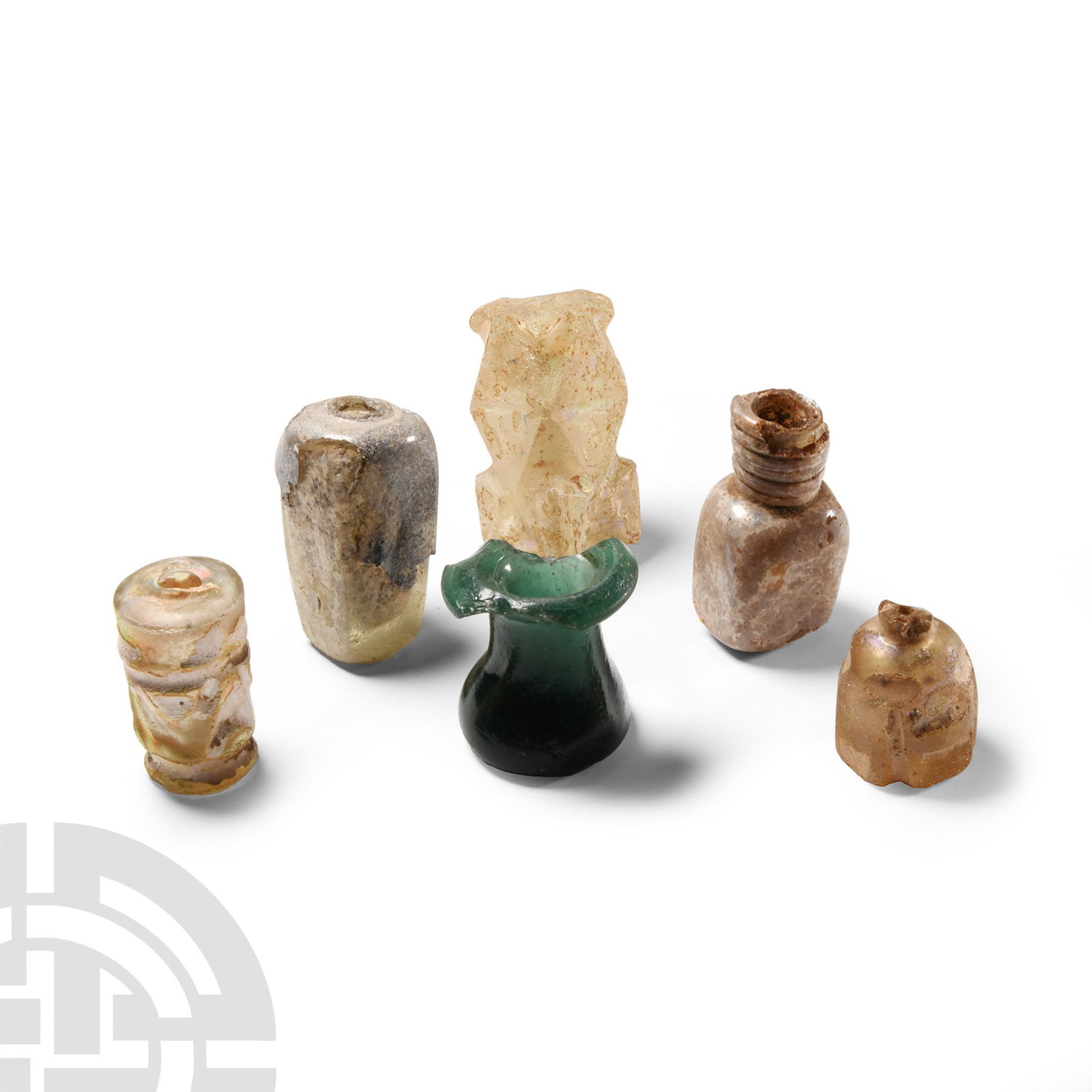 Western Asiatic Glass Vessel Collection: 8th-10th century A.D.. Including cut glass molar flasks; chipped. 114 grams total, 27-51 mm (1 - 2 in.). Acquired 1970s-1996. Property of a North American collector. London collection, 2016. [6, No Re