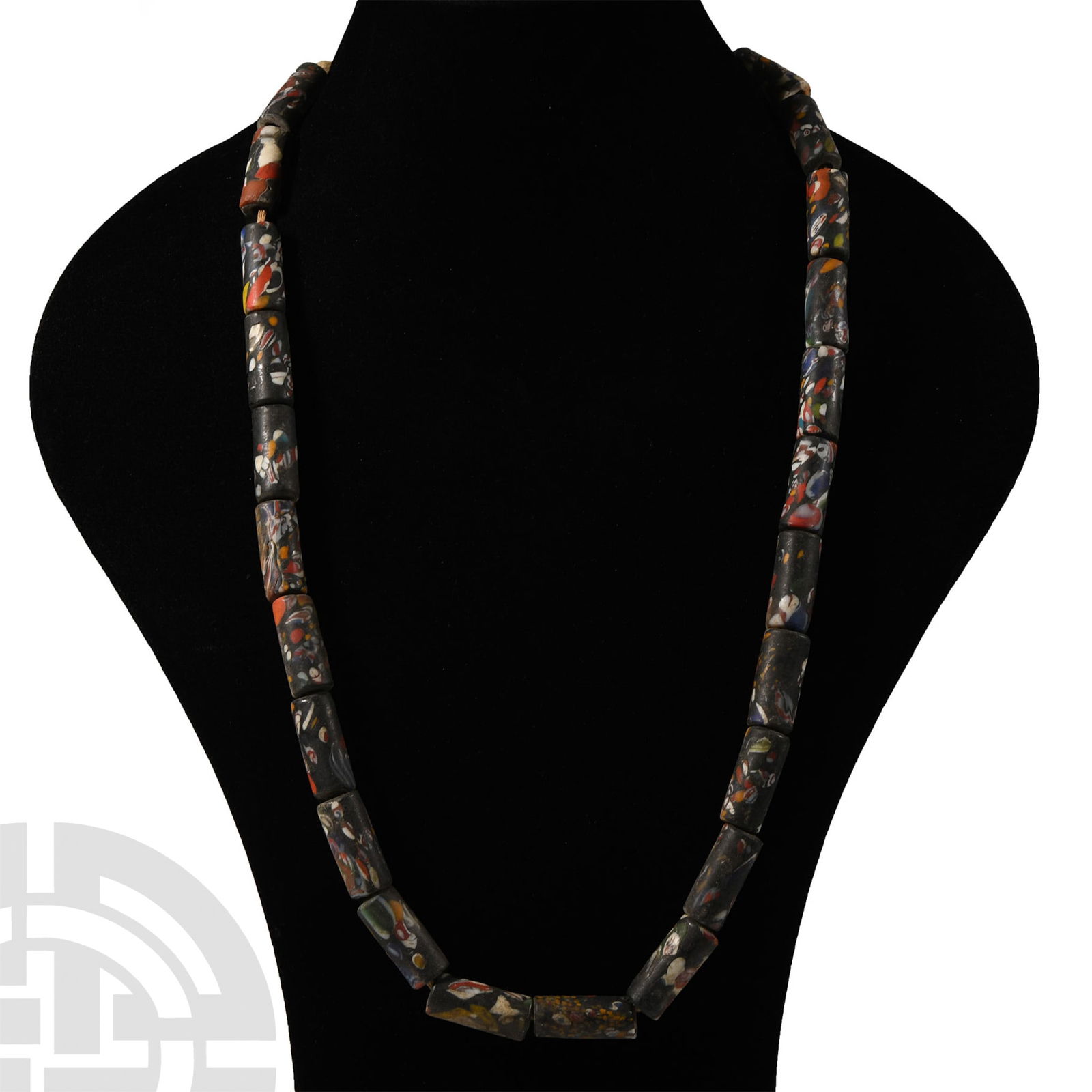 Tribal Mosaic Glass Bead Necklace: 20th century A.D.. Composed from tubular beads in polychrome mosaic glass on a thick cord. 156 grams, 74 cm long (29 1/8 in.). From the family collection of a Maida Vale lady, UK. [No Reserve]
