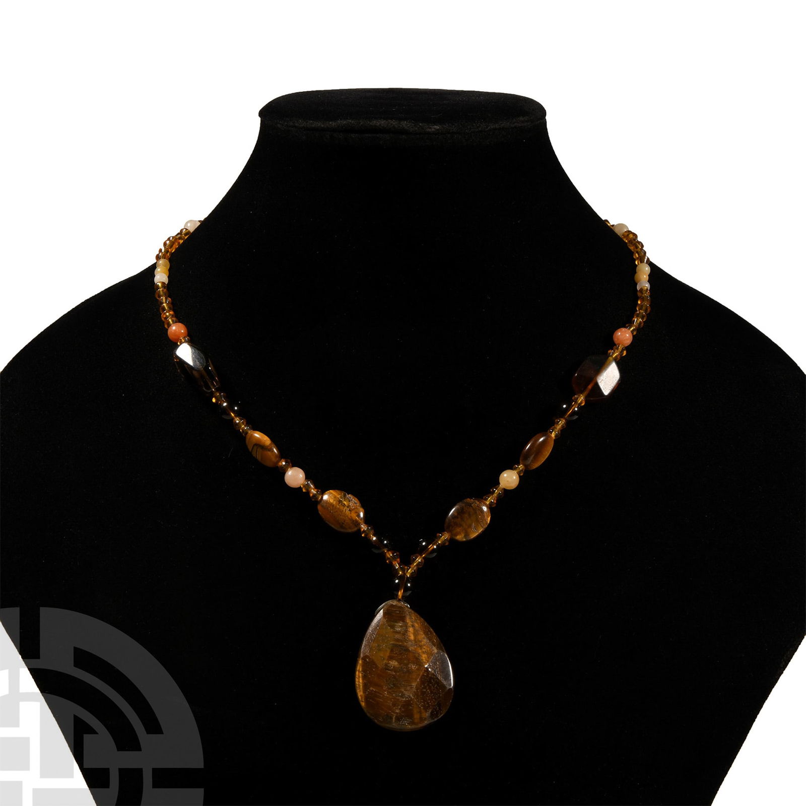 Natural History - Tiger's Eye Pendant Designer Necklace: 20th century A.D.. Featuring quartz or agate beads, biconical glass beads and oval tiger's eye beads, with a facetted tear-shaped tiger's eye pendant bead. 36 grams total, 42 cm long (16 1/2 in.). UK
