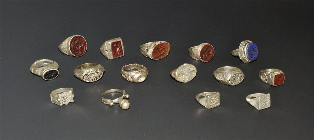 Islamic Silver Finger Rings Group: A mixed group of white metal finger rings of various dates comprising: two with discoid intaglio, animal motifs; two similar, elliptical intaglio; two similar, rectangular intaglio; four with integral