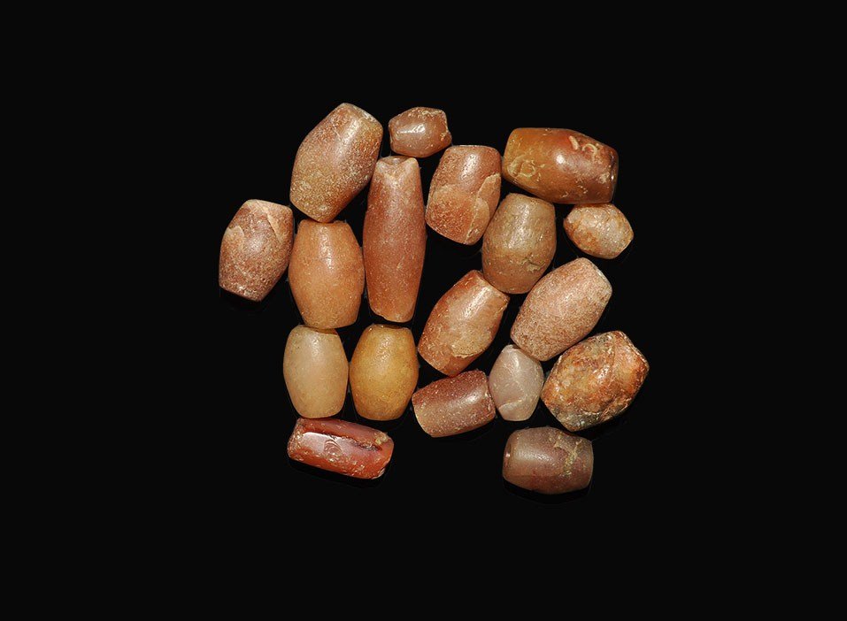 African Tribal Carnelian Biconical Bead Group: A mixed group of old biconical and oblate carnelian beads from Mali, West Africa; one facetted. 81 grams, 11-31 mm (1/4 - 1 1/4"). From a London collection. [18, No Reserve]