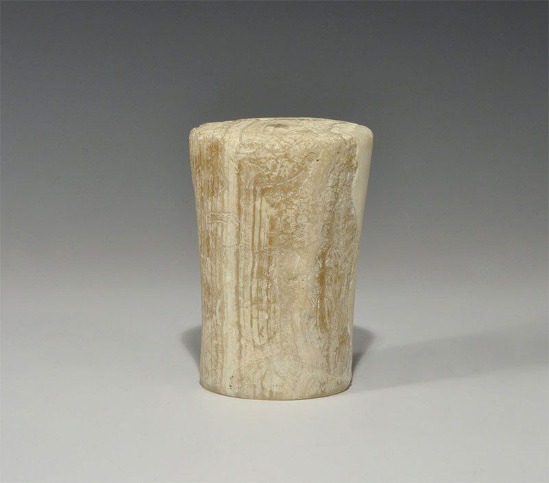 Near Eastern Bactrian Alabaster Vessel: 2200-1700 BC. A carved alabaster vessel, with conical base and tubular body. 782 grams, 12 cm (4 1/2"). Property of a German gentleman living in London.