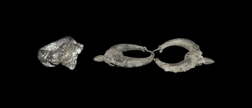 Islamic Silver Earrings and Finger Ring: A mixed group of undated jewellery items comprising: a pair of earrings, each lunate in profile with granulation to the outer edge, transverse band and knop beneath; a finger ring with c-section hoop,