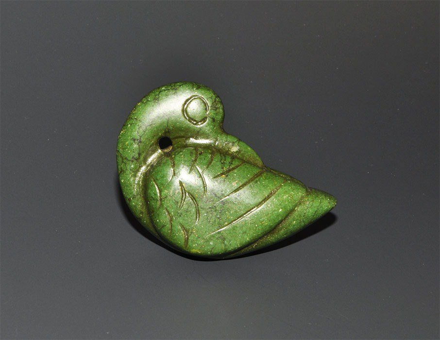 Chinese Style Green Nephrite Duck Figurine: An undated carved deep green nephrite pendant in the form of a duck with recurved neck, feather detailing to the wings. 41 grams, 62 mm (2 1/2"). Acquired on the London art market in the 1960's. [No R