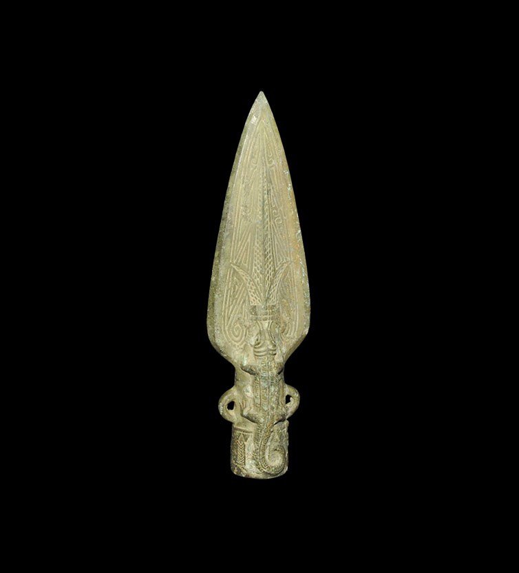 Chinese Style Bronze Zoomorphic Spearhead: An undated archaistic Han style cast bronze spearhead with thick, leaf-shaped blade and round-section socket with attachment loops to the sides; the blade and socket decorated with a lizard and geomet