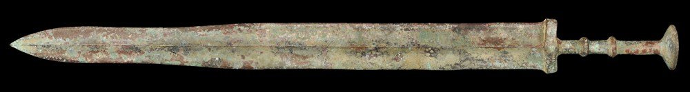 Chinese Bronze Sword: Han Dynasty, 206 BC-220 AD. A cast bronze short sword with central midrib to the parallel-sided blade; transverse discoid ribs to the grip and large discoid pommel above. 643 grams, 55 cm (21 1/2"). E