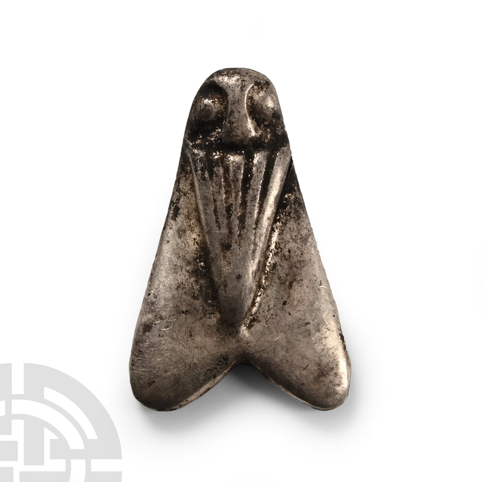 Egyptian Silver Fly Amulet: Late Period, 664-332 B.C. D-shaped in section with two triangular wings and robbed body with pellet eyes. Cf. Andrews, C., Amulets of Ancient Egypt, London, 1994, pp.62-3. 1.07 grams, 16 mm (5/8 in.).