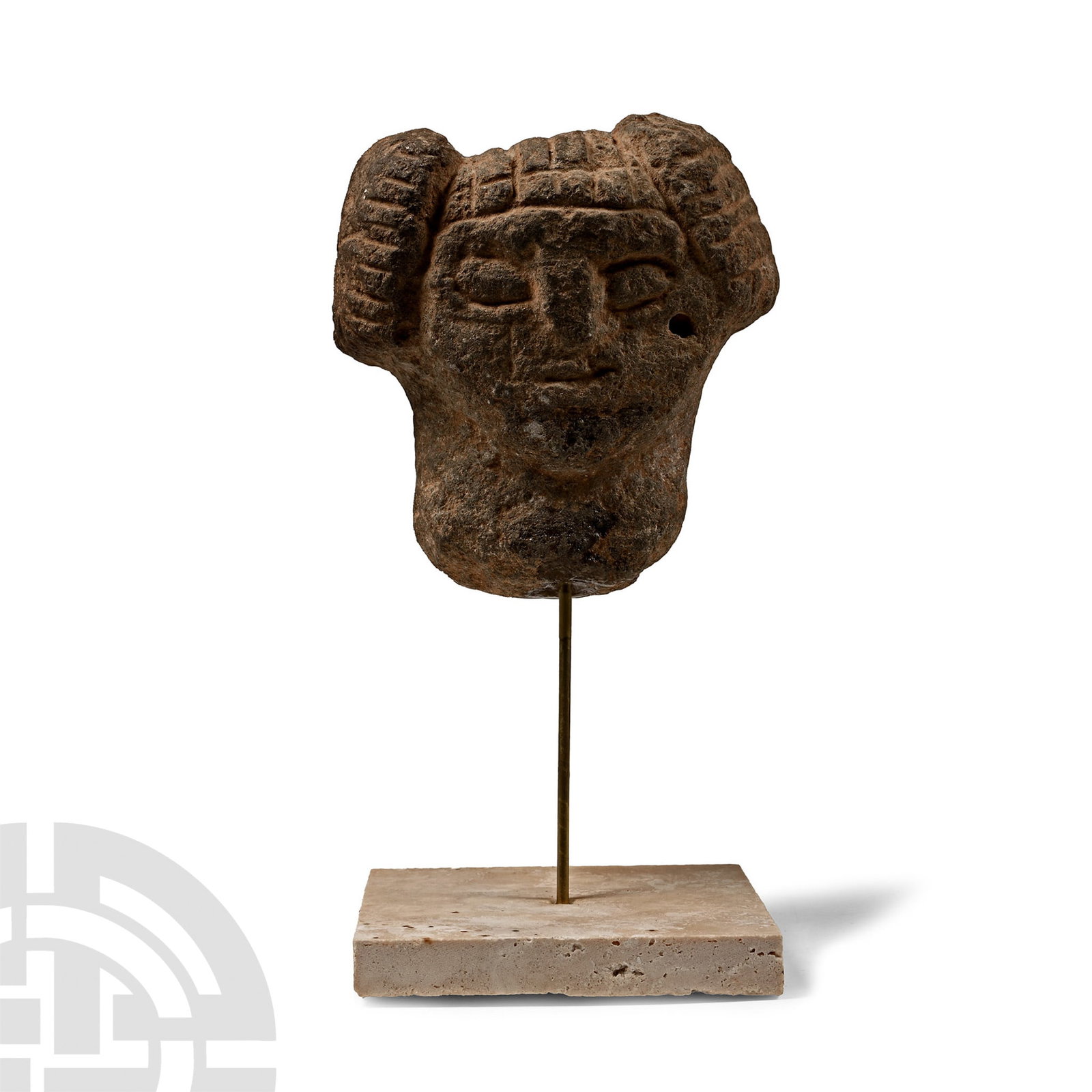 Phoenician-Iberian Stone Head of a Lady: Circa 600 B.C. or later. Carved in the round with hatched hair and low-relief facial features; mounted on a custom-made stand. 857 grams total, 17 cm high including stand (6 3/4 in.). [No Reserve] Fro
