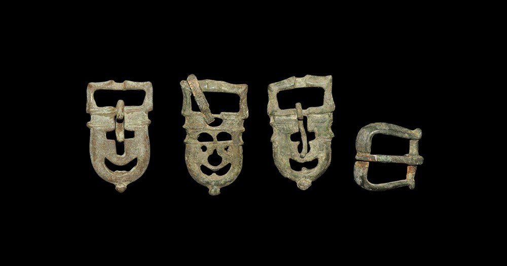 Byzantine Bronze Buckle Group: 6th-12th century AD. A mixed group of cast bronze belt buckles comprising: two with rectangular loop, D-shaped plate,, three pierced lugs to the reverse, cross and crescent voids to the plate; one sim