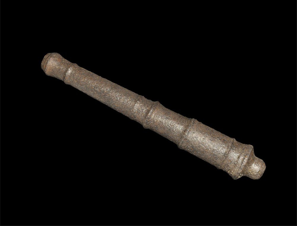 Post Medieval Iron Hand Cannon Barrel: 16th-17th century AD. A cast hand cannon barrel, tapering with bulbous muzzle and six circumferential ribs; the bore reemed but without a touch-hole, possibly an unfinished casting. 1.3 kg, 26 cm (10 
