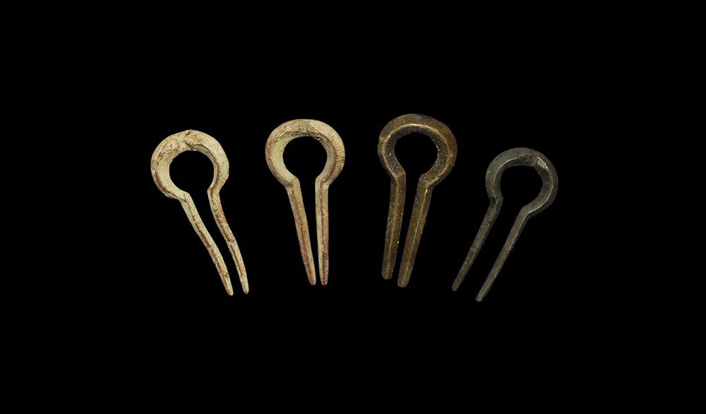 Post Medieval Bronze Jews Harp Group: Circa 17th century AD. A group of four cast bronze jews' harps, each with carinated section and 'omega' profile. 58 grams, 56-60 mm (2 1/4 "). Property of an East London gentleman; found various sites