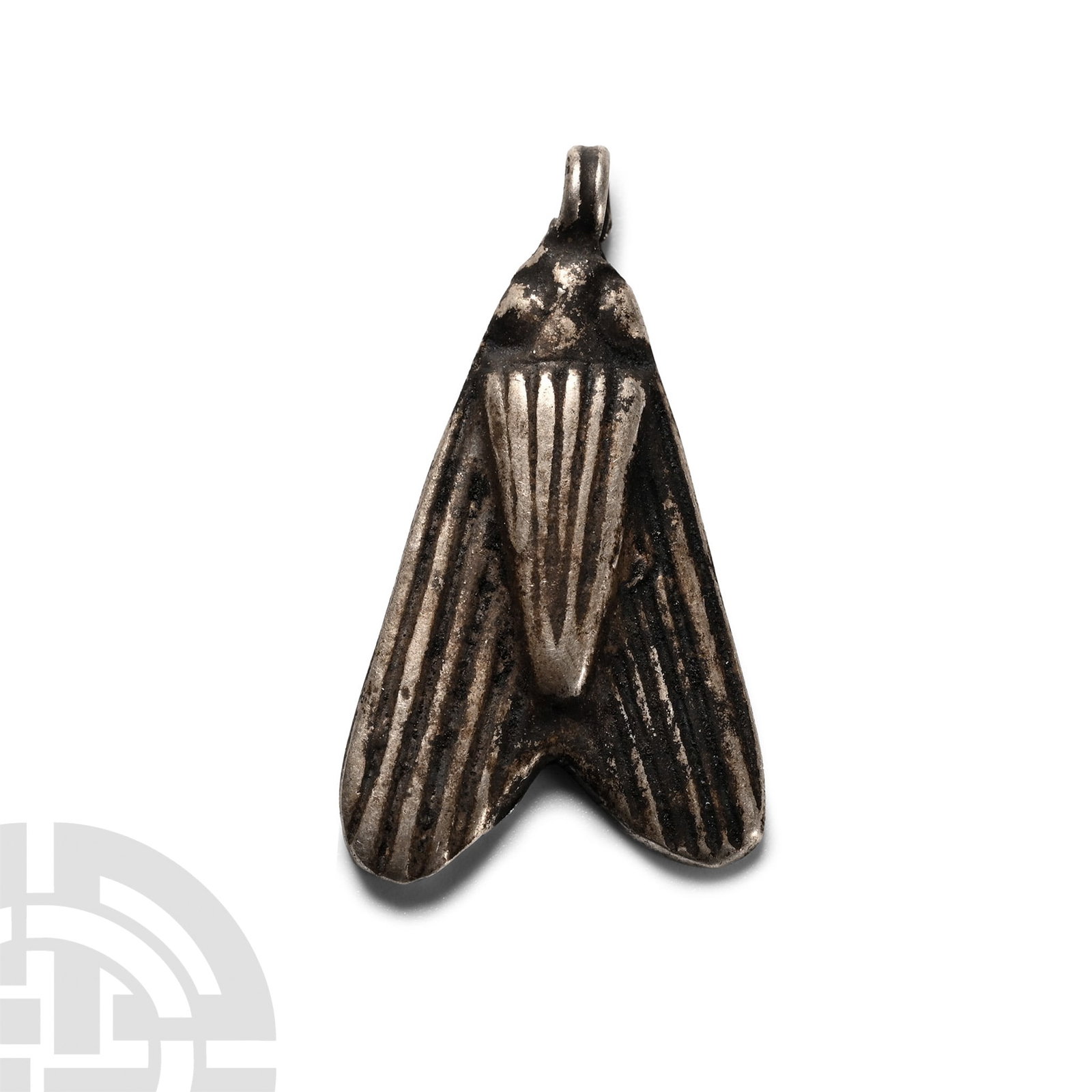 Egyptian Silver Fly Amulet: Late-Ptolemaic Period, 664-30 B.C. With linear detailing to body and wings, loop above the head. Cf. Andrews, C., Amulets of Ancient Egypt, London, 1994, pp.62-3. 2 grams, 24 mm (1 in.). [No Reserve] 