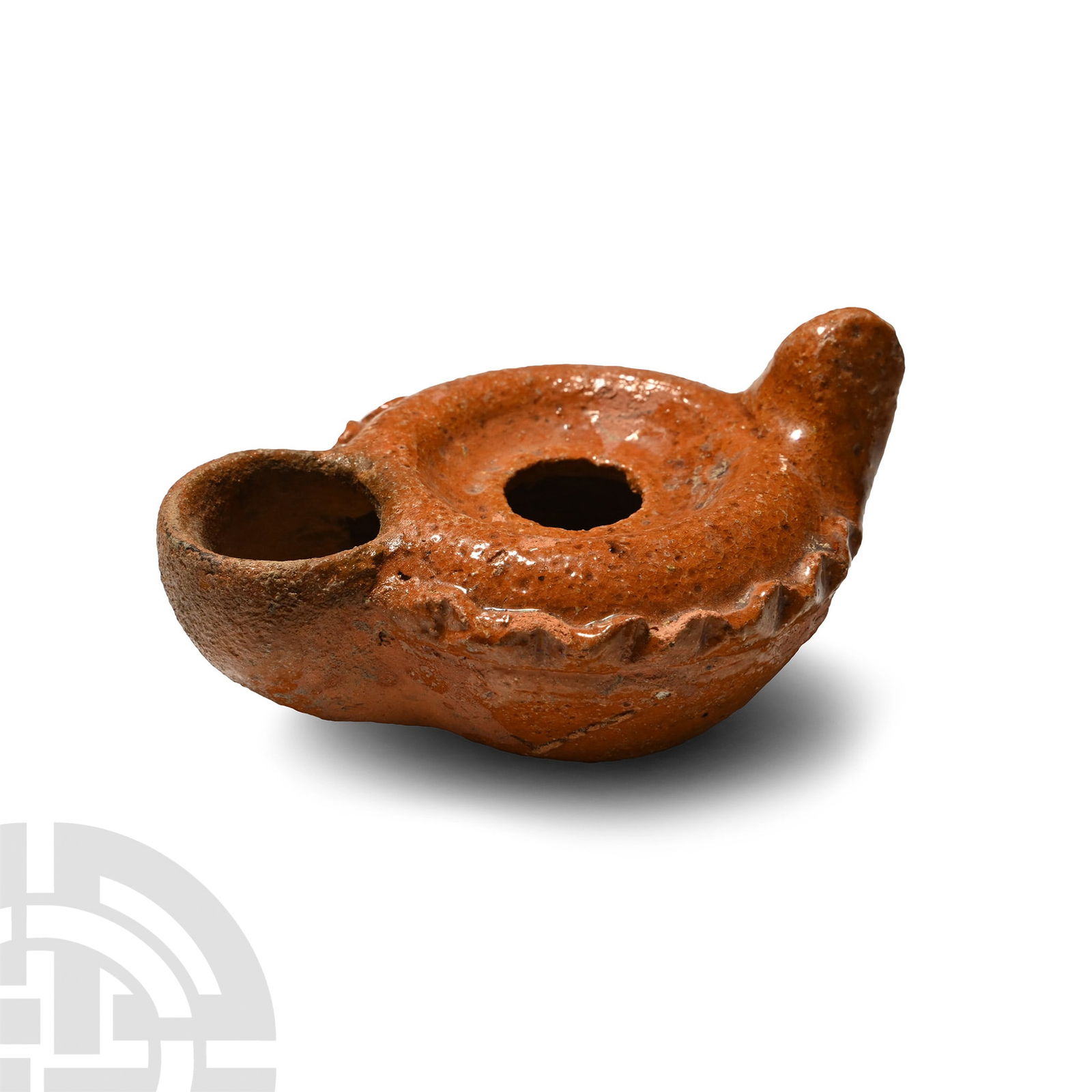 Byzantine Glazed Terracotta Oil Lamp: 8th-10th century A.D. Squat in profile with lug handle and large D-shaped nozzle, raised discus and piecrust shoulder. 70.8 grams, 84 mm (3 1/4 in.). [No Reserve] Acquired from Alan Cherry, Bournemout