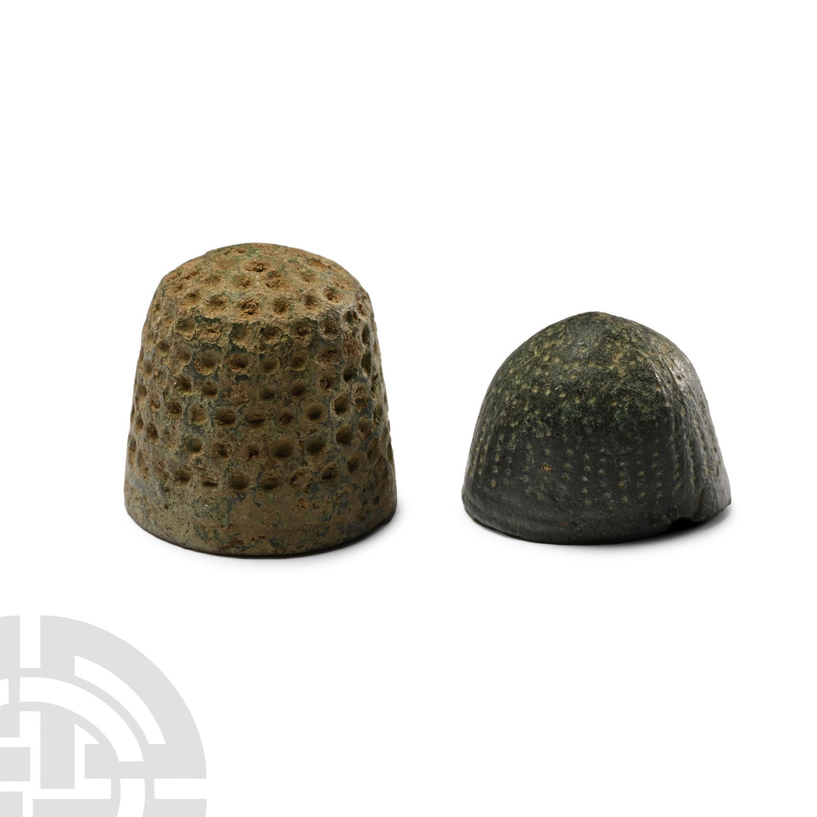 Medieval Bronze Beehive Thimble Group: 14th-15th century A.D. Comprising two thimbles with punched pellets to the upper faces. See McConnel, B., The Collector's Guide to Thimbles, London, 1996. 13.9 grams total, 19 mm each (3/4 in.). [2, N