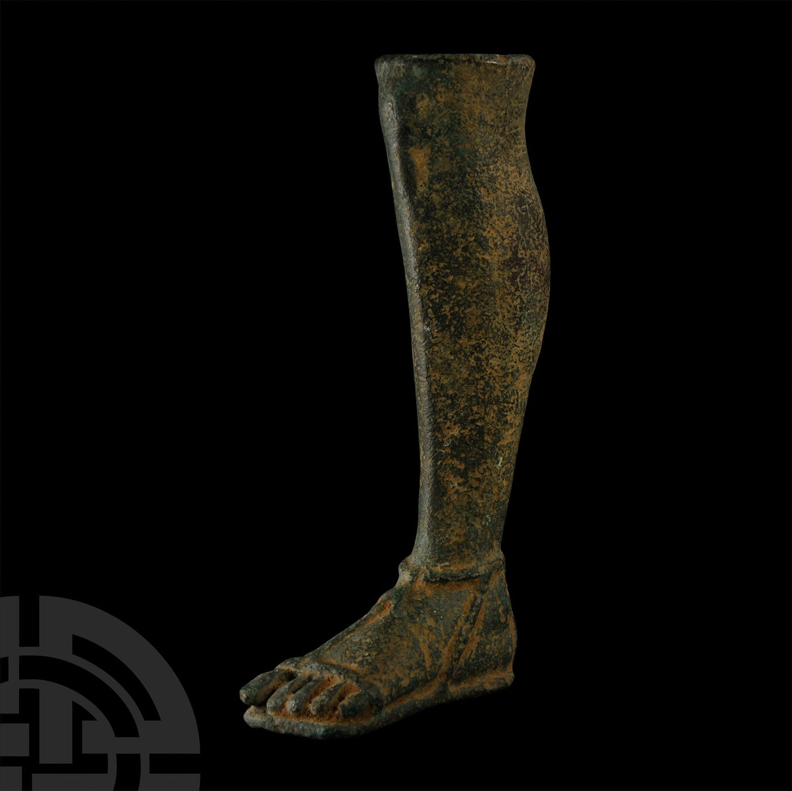 Roman Style Bronze Votive Sandaled Foot: 19th century A.D. Hollow-formed lower left leg with integral modelled sandal; open at the knee. 459 grams, 15.5 cm (6 1/8 in.). [No Reserve] English private collection.