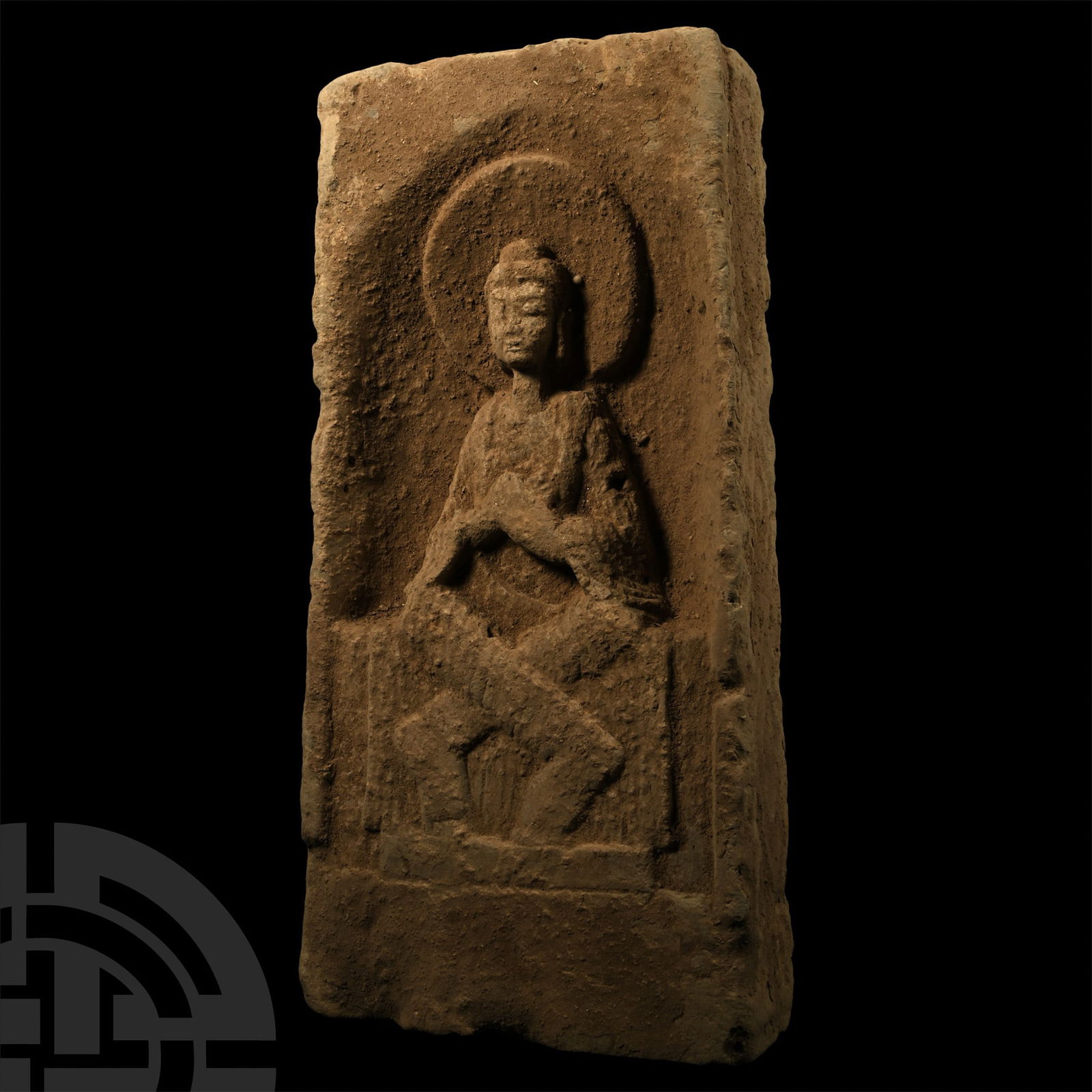 Chinese Wei Terracotta Buddha Brick: Northern Wei, 386-534 A.D. or later. Rectangular block with recess to obverse, Buddha seated in a lotus pose on a low throne, his robe draped at the chest and legs. 3.1 kg, 29.5 x 14 cm (11 5/8 x 5 1/