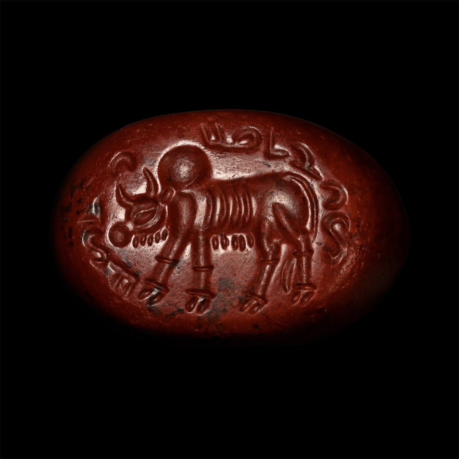 Sasanian Jasper Stamp Seal with Pahlavi Inscription: 3rd-5th century A.D. Plano-convex in profile with intaglio zebu inside a Pahlavi legend. 5.04 grams, 18 mm (3/4 in.). UK private collection before 2000. Acquired on the UK art market. Private collecti