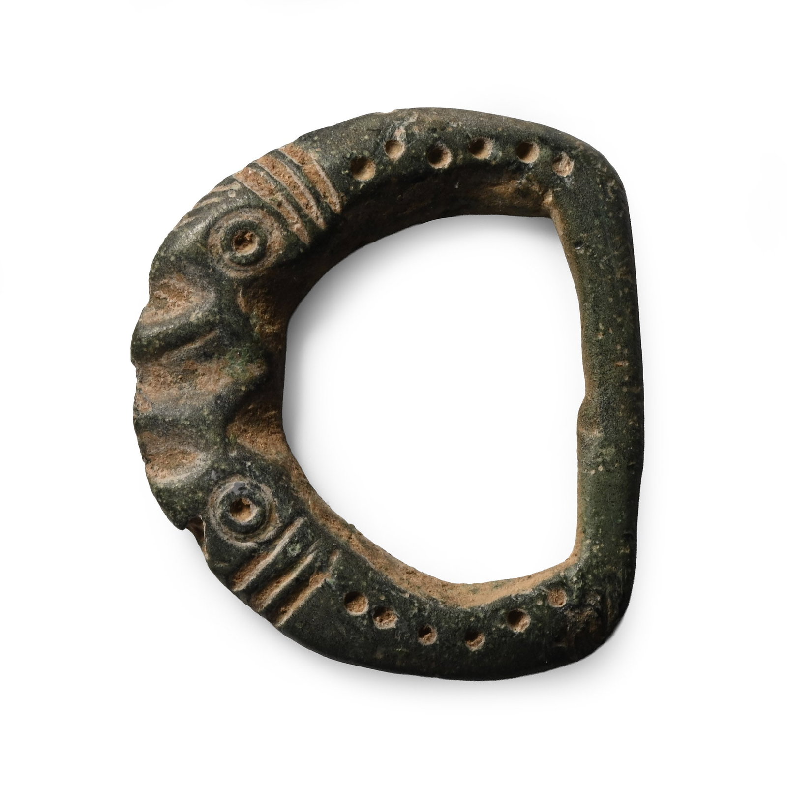 Roman Buckle with Animal Heads: 1st-4th century A.D. D-section loop with two opposing stylised animals with gaping jaws, incised detailing. 3.14 grams, 23 mm (1 in.). [No Reserve] Acquired on the UK art market before 2000. Property 