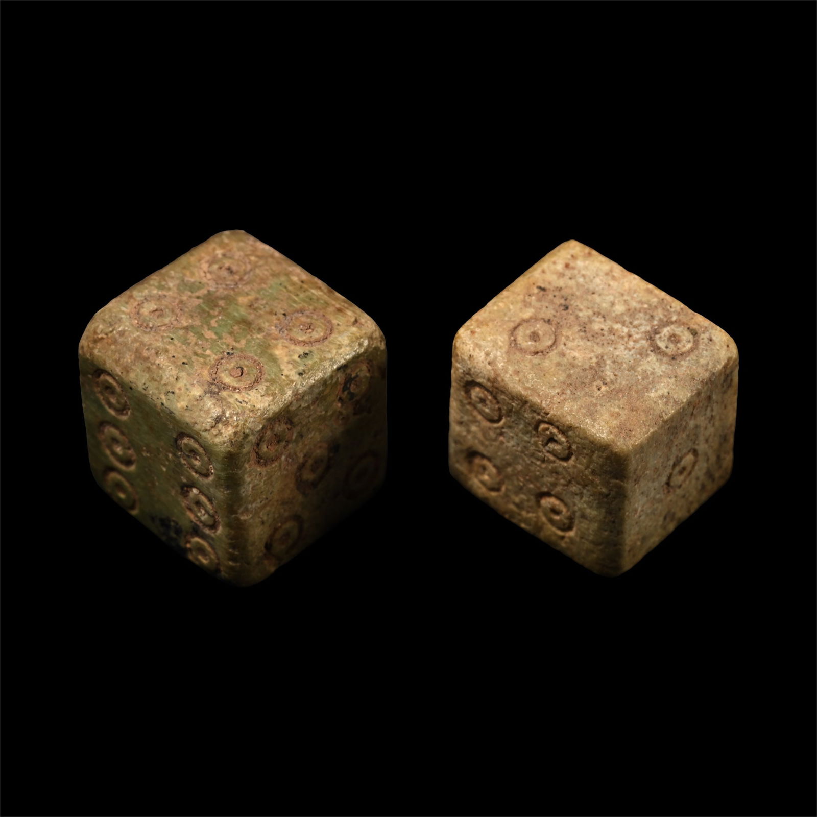 Roman Bone Gaming Dice Pair: 1st-3rd century A.D. Each cuboid with ring-and-dot markings disposed 1:6, 2:5, 3:4. 5384 grams total, 12 mm each (1/2 in.). [2] (For this specific lot, 5% import VAT is applicable on the hammer price.