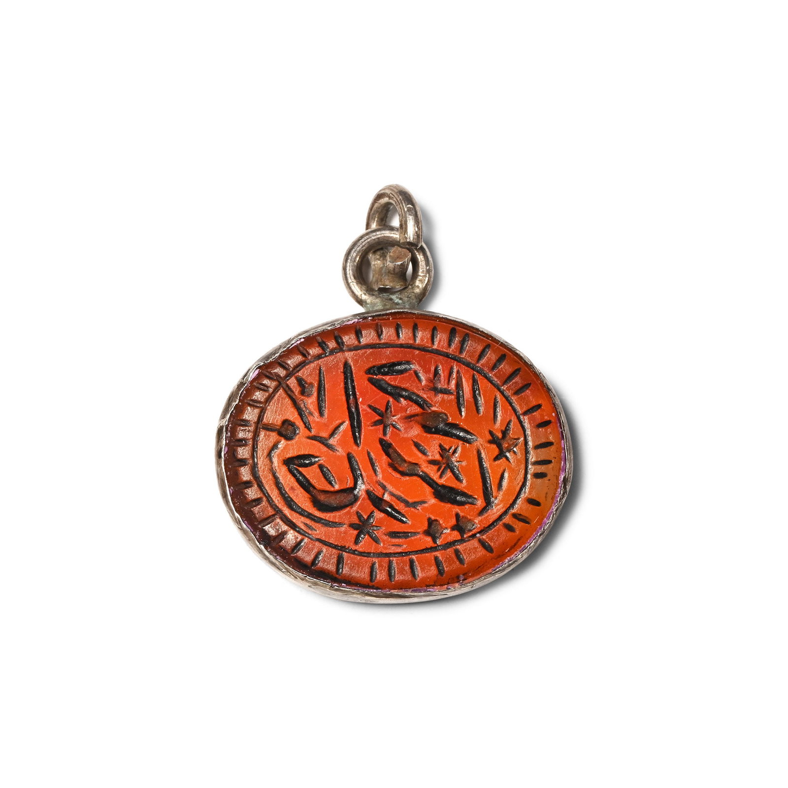 Silver Pendant with Engraved Garnet: 19th-20th century A.D. Ellipsoid garnet cloison with segmented border and calligraphic inscription, in silver cell with loop. 2.37 grams, 17 mm (5/8 in.). [No Reserve] Private collection, London. This